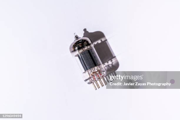 old vacuum electronic radio and television tubes on white background - old amplifier stock pictures, royalty-free photos & images