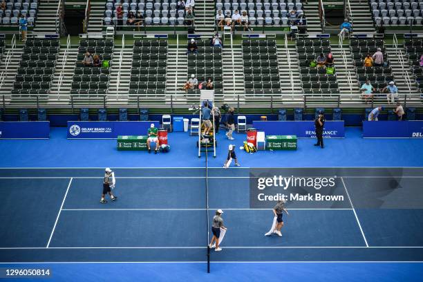 The Delray Open Ball Crew wipes down the court during a stoppage in play between Christian Harrison and Hubert Hurkacz of Poland in the Semifinals of...