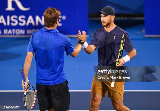 Christian Harrison and his brother Ryan Harrison celebrate after winning in two sets against Hugo Nys of Monaco and Andrés Molteni of Argentina in...