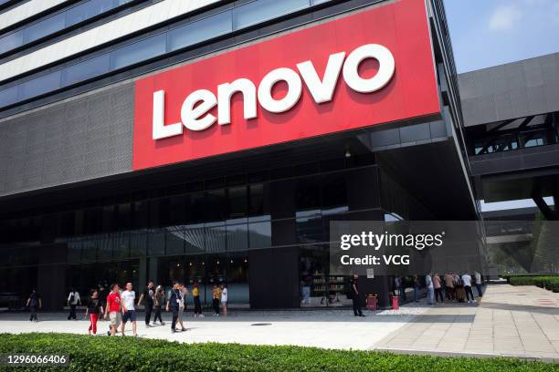 People walk by the Lenovo Group Ltd. Headquarters on August 8, 2019 in Beijing, China.