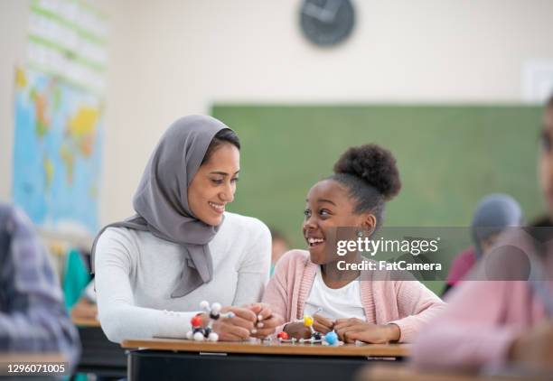 thanks for helping me, teacher! - hijab stock pictures, royalty-free photos & images