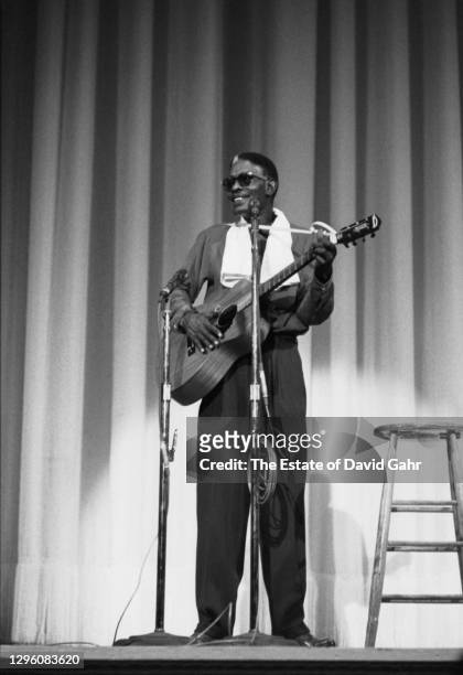 Blues singer Lightnin' Hopkins performs at the Carnegie Hall Hootenanny in October 1960 in New York City, New York.