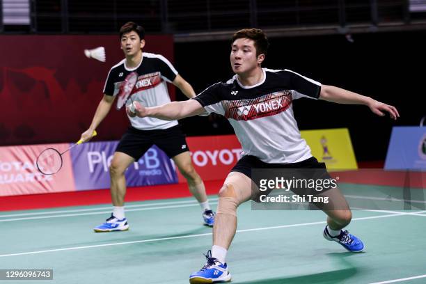Lee Yong Dae and Kim Gi Jung of Korea compete in the Men's Doubles first round match against Satwiksairaj Rankireddy and Chirag Shetty of India on...