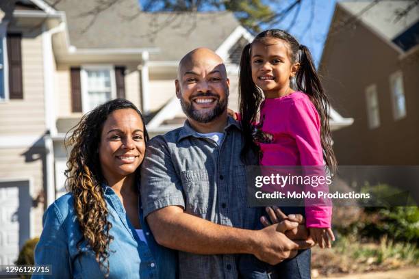 portrait of family in front of home - african american girl wearing a white shirt stock pictures, royalty-free photos & images