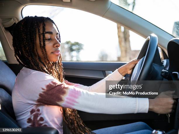 portrait of teenage girl in her first car - driving school stock pictures, royalty-free photos & images