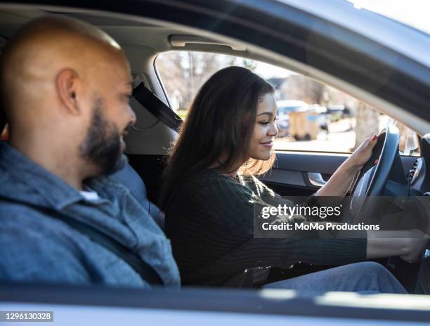 father handing car keys to teenage daughter - learning to drive stock pictures, royalty-free photos & images