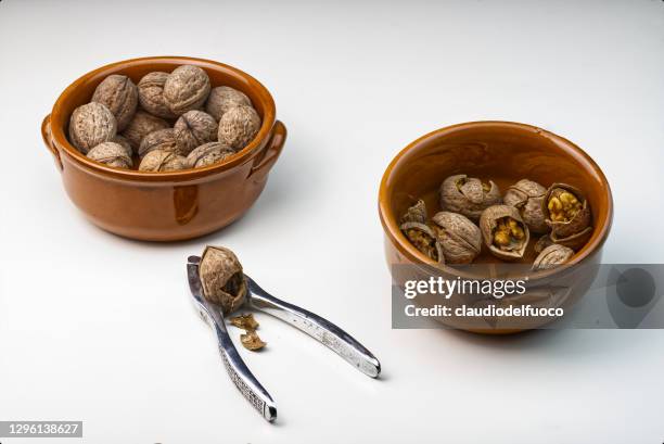 walnuts and nutcracker - nutcracker stock pictures, royalty-free photos & images