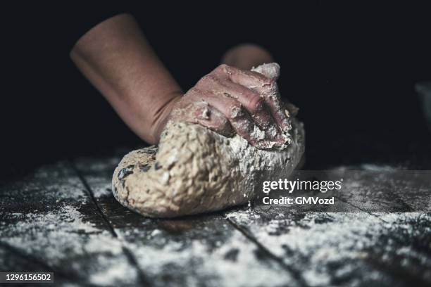 kneading loaf of sourdough bread with hands - baking bread imagens e fotografias de stock