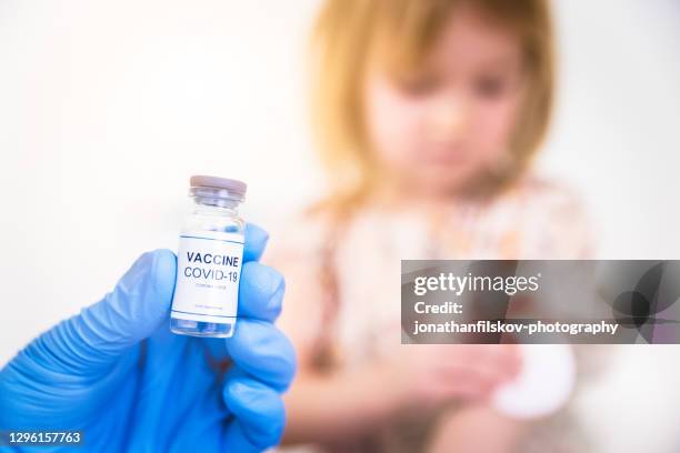 vaccination of child with anti covid-19 vaccine - covid 19 vaccine stock pictures, royalty-free photos & images