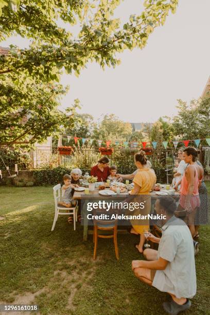 an outdoors family party - backyard summer party stock pictures, royalty-free photos & images