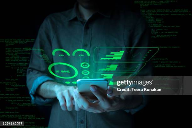 businessman with a tablet is showing a growing virtual hologram stock and finance and investment concept.money management and financial chart. - smartphone hologram stockfoto's en -beelden