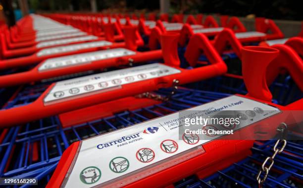 Shopping carts are parked outside a Carrefour supermarket on January 13, 2021 in Paris, France. French retailer Carrefour today confirmed "very...