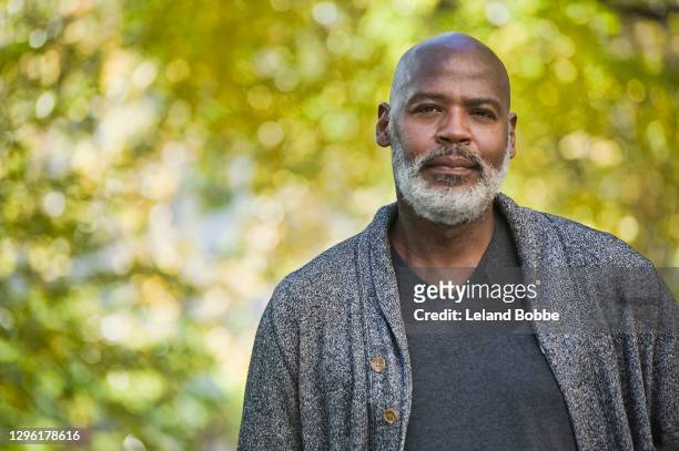 portrait of middle aged african american man - 50's man stock pictures, royalty-free photos & images