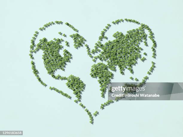 a heart-shaped world map made from a collage of ivy. - heart concept business stock pictures, royalty-free photos & images