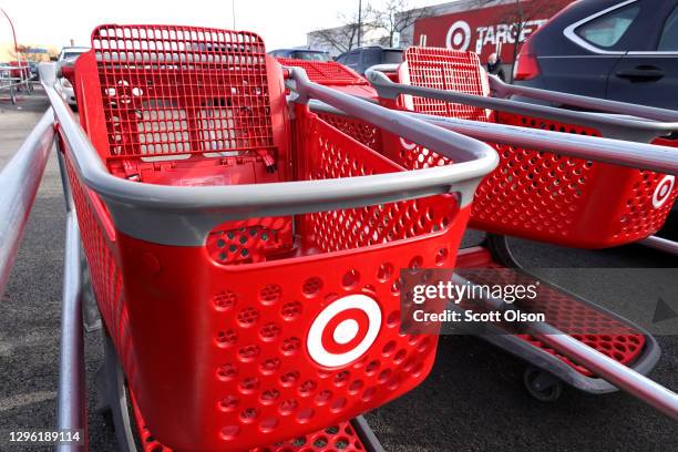 Shopping carts sit in a cart corral in the parking lot of a Target store on January 13, 2021 in Chicago, Illinois. Target announced today that...