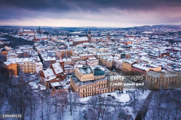 aerial view of snow covered krakow in poland - krakow stock pictures, royalty-free photos & images