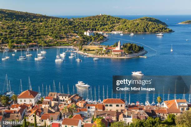 vis town, franciscan monastery and harbour, vis island, croatia - vis fotografías e imágenes de stock