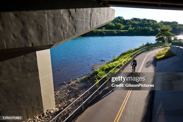 calgary bicycle commuter - calgary bridge stock pictures, royalty-free photos & images