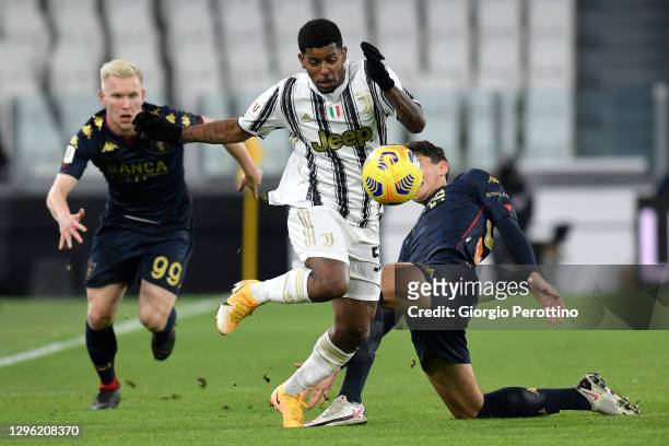 Wesley of Juventus is challenged by Lennart Czyborra and Daniel Dumbravanu of Genoa CFC during the Coppa Italia match between Juventus and Genoa CFC...