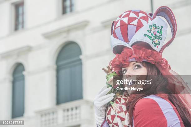 woman with frog at  venice carnival - venice carnival 2013 stock pictures, royalty-free photos & images