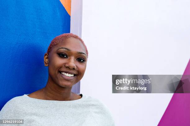 headshot of confident attractive african american young woman - girl power graffitti stock pictures, royalty-free photos & images