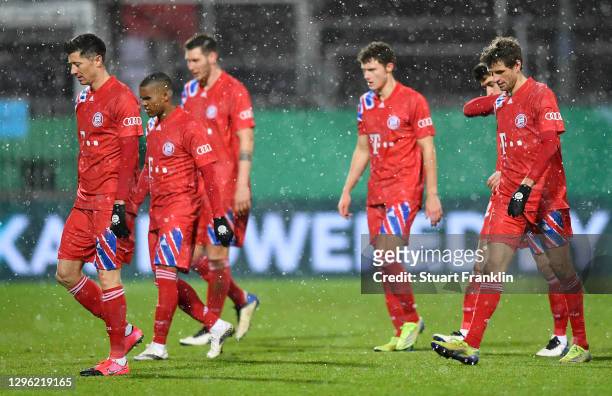 Robert Lewandowski, Thomas Mueller of Bayern Munich and teammates react as they prepare to go into extra-time during the DFB Cup second round match...