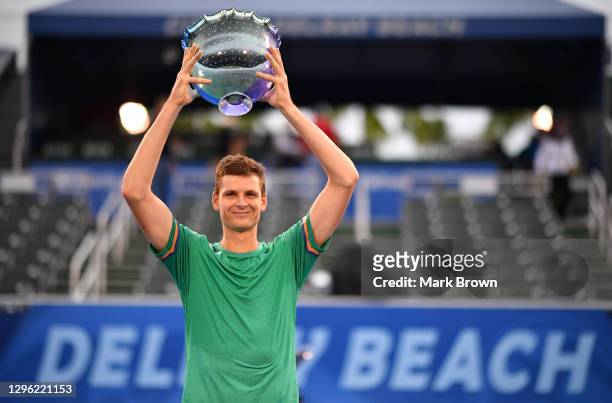 Hubert Hurkacz of Poland poses with the Delray Open Trophy after winning against Sebastian Korda in the Finals of the Delray Beach Open by...
