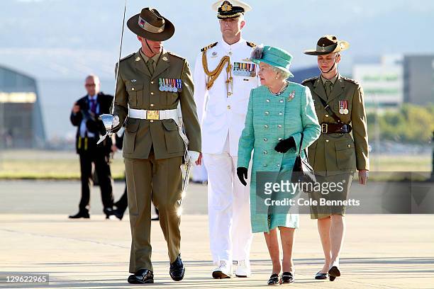 Queen Elizabeth II speaks to members of the armed forces as she arrives on October 19, 2011 in Canberra, Australia. The Queen and Duke of Edinburgh...