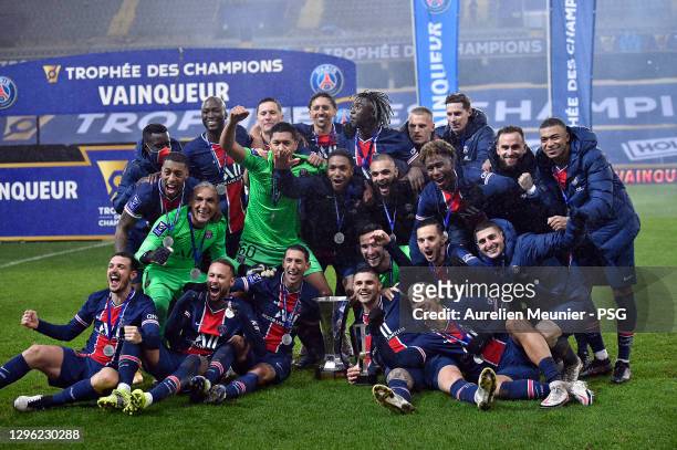 Paris Saint-Germain players pose with the trophy after the Champions Trophy match between Paris Saint-Germain and Olympique de Marseille at Stade...