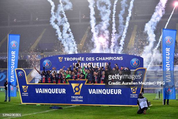 Paris Saint-Germain players pose with the trophy after the Champions Trophy match between Paris Saint-Germain and Olympique de Marseille at Stade...