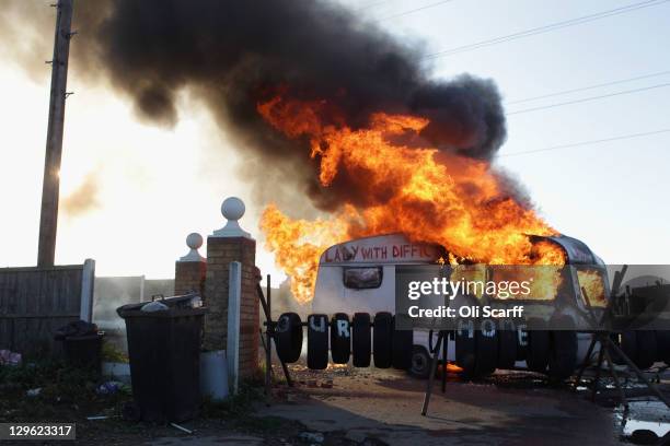 Flames engulf a caravan during evictions from Dale Farm travellers camp on October 19, 2011 near Basildon, England. Travellers have fought for 10...