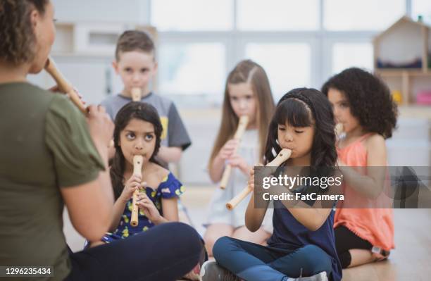 music class in preschool classroom - recorder musical instrument stock pictures, royalty-free photos & images