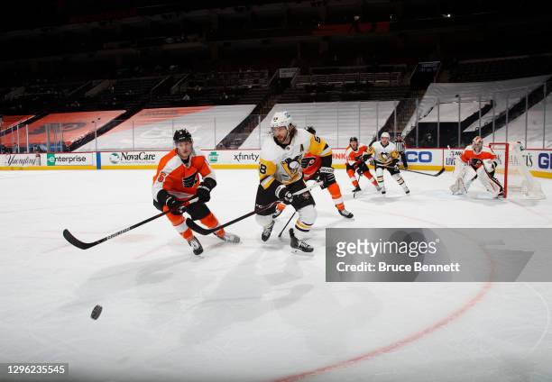 In front of an empty arena, the Philadelphia Flyers skate against the Pittsburgh Penguins at the Wells Fargo Center on January 13, 2021 in...