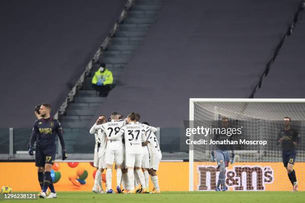 Juventus players celebrate after Dejan Kulusevski scored to give the side a 1-0 lead during the Coppa Italia match between Juventus and Genoa CFC at...