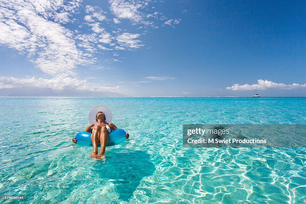 Woman relaxing on floating