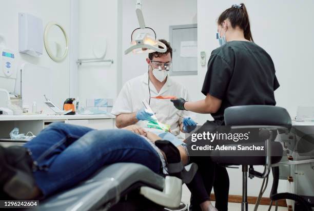 dedicated to ridding the world of tooth decay - root canal stock pictures, royalty-free photos & images