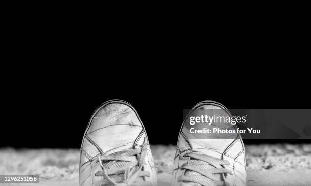 the feet of desperate people standing on a cliff at the bottom are rivers. and below that abyss is death. - suicide stock pictures, royalty-free photos & images