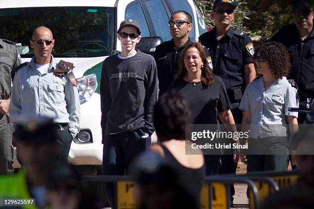 Gilad Shalit walks with his mother Aviva outside their home on October 19, 2011 in Mitzpe Hila, Israel. Shalit was freed yesterday after being held...