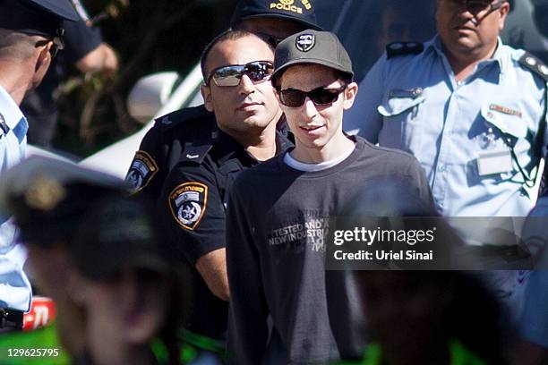 Gilad Shalit walks with his mother Aviva outside their home on October 19, 2011 in Mitzpe Hila, Israel. Shalit was freed yesterday after being held...