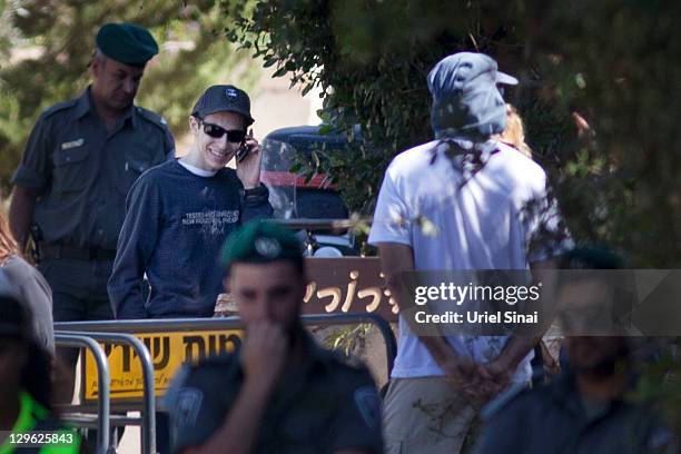 Gilad Shalit smiles as he talks on a mobile phone outside his home on October 19, 2011 in Mitzpe Hila, Israel. Shalit was freed yesterday after being...