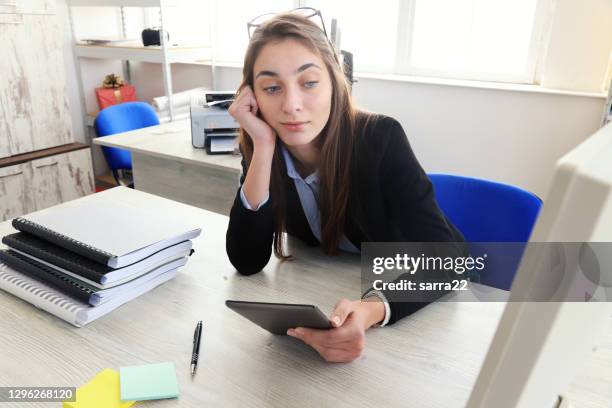 business woman usnig digital tablet - russian ethnicity stock pictures, royalty-free photos & images