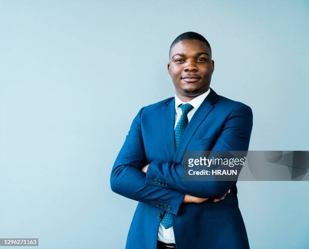 confident businessman with arms crossed - formal portrait stock pictures, royalty-free photos & images