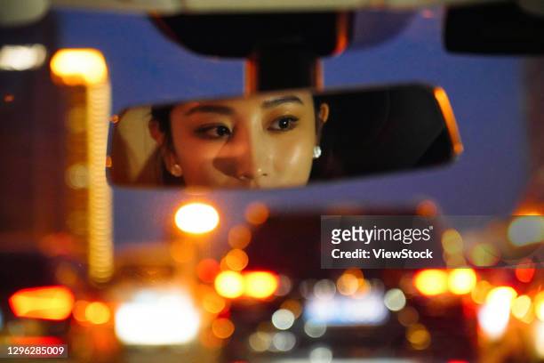 car rearview mirror display of young women - rear view mirror stock pictures, royalty-free photos & images