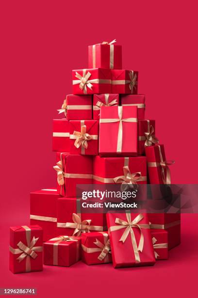 piles of presents - pile of gifts stock pictures, royalty-free photos & images