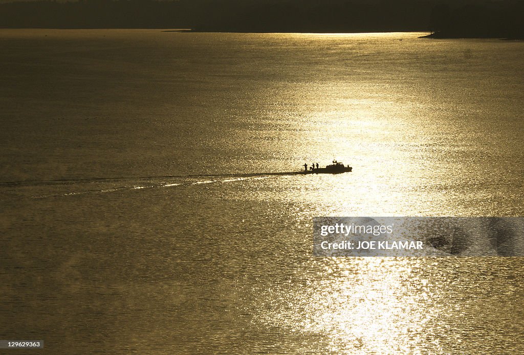 A sports fisherman tries his luck early