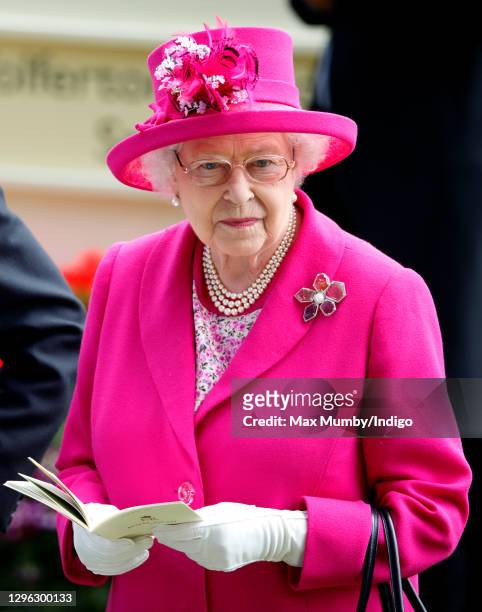 Queen Elizabeth II watches the horses in the parade ring as she attends Day 4 of Royal Ascot at Ascot Racecourse on June 20, 2014 in Ascot, England.