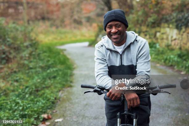 senior man on a morning cycle - cycling uk stock pictures, royalty-free photos & images