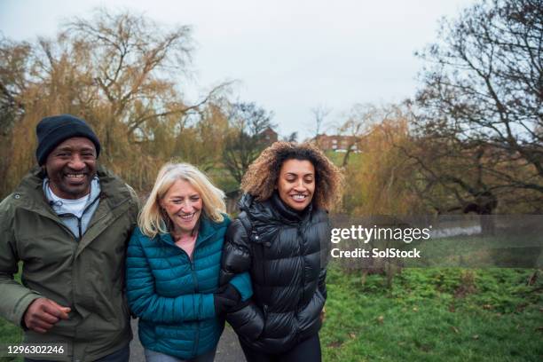 family morning walk through the park - european sports pictures of the month december stock-fotos und bilder