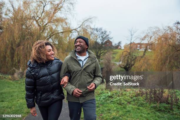 walk through the park with my dad - winter health imagens e fotografias de stock