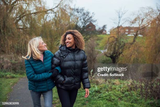 walk through the park with my mam - winter relaxation stock pictures, royalty-free photos & images